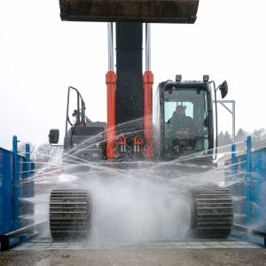Demucking construction vehicle wash
